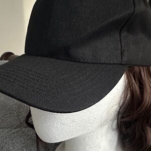 Elegant Black  Cap with dark brown wig extension.